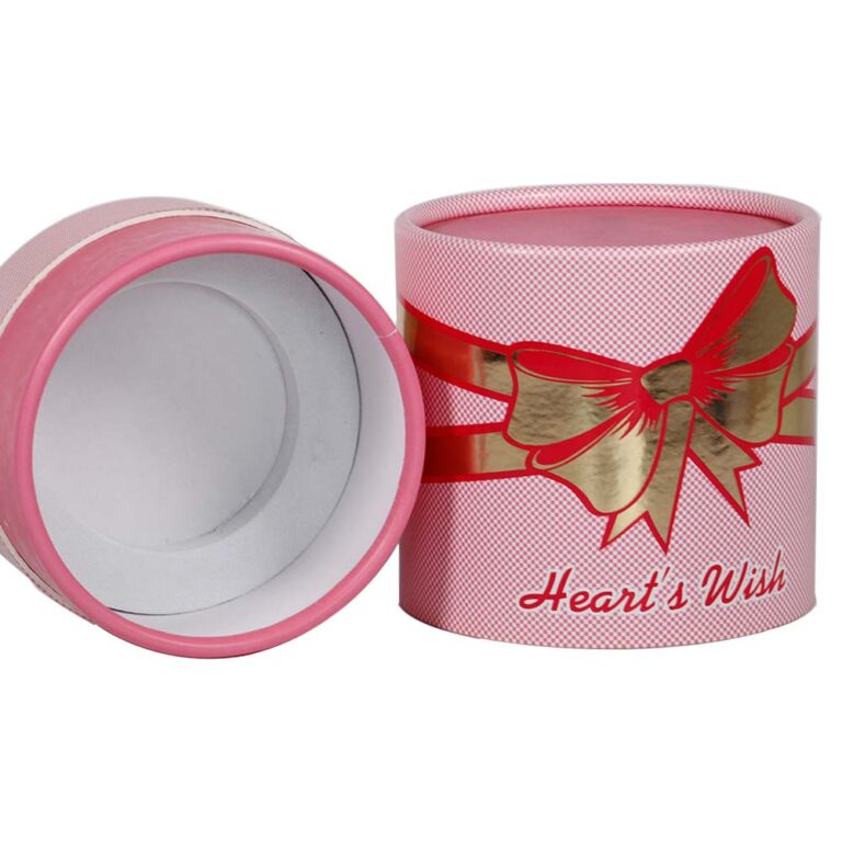 Růžové kartonové tuby pro balení parfémů s pěnovým držákem